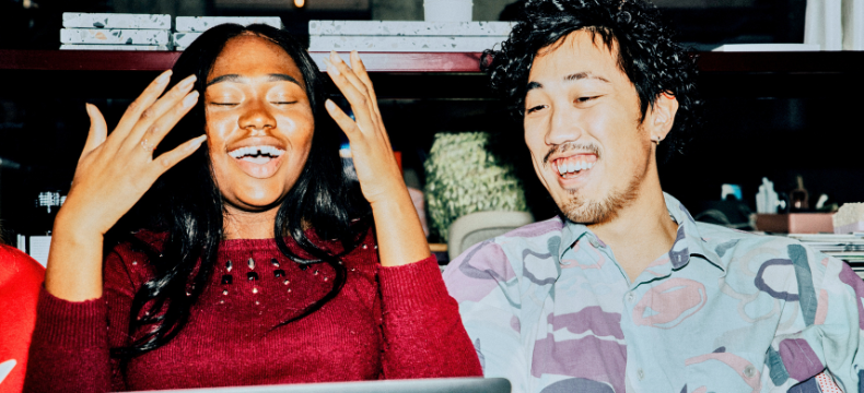 young people behind laptop